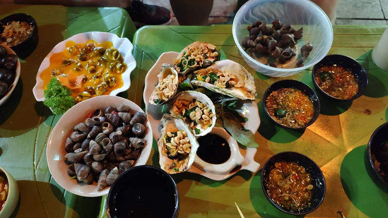 Mix of snail dish served in Vietnam