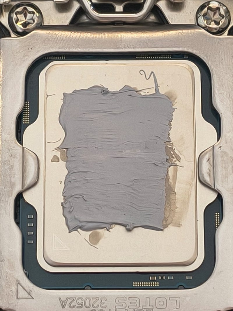 Normal application of thermal paste with some significant margin to spread under load.
